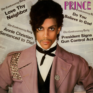 Prince looking directly at the person with newspaper articles behind him